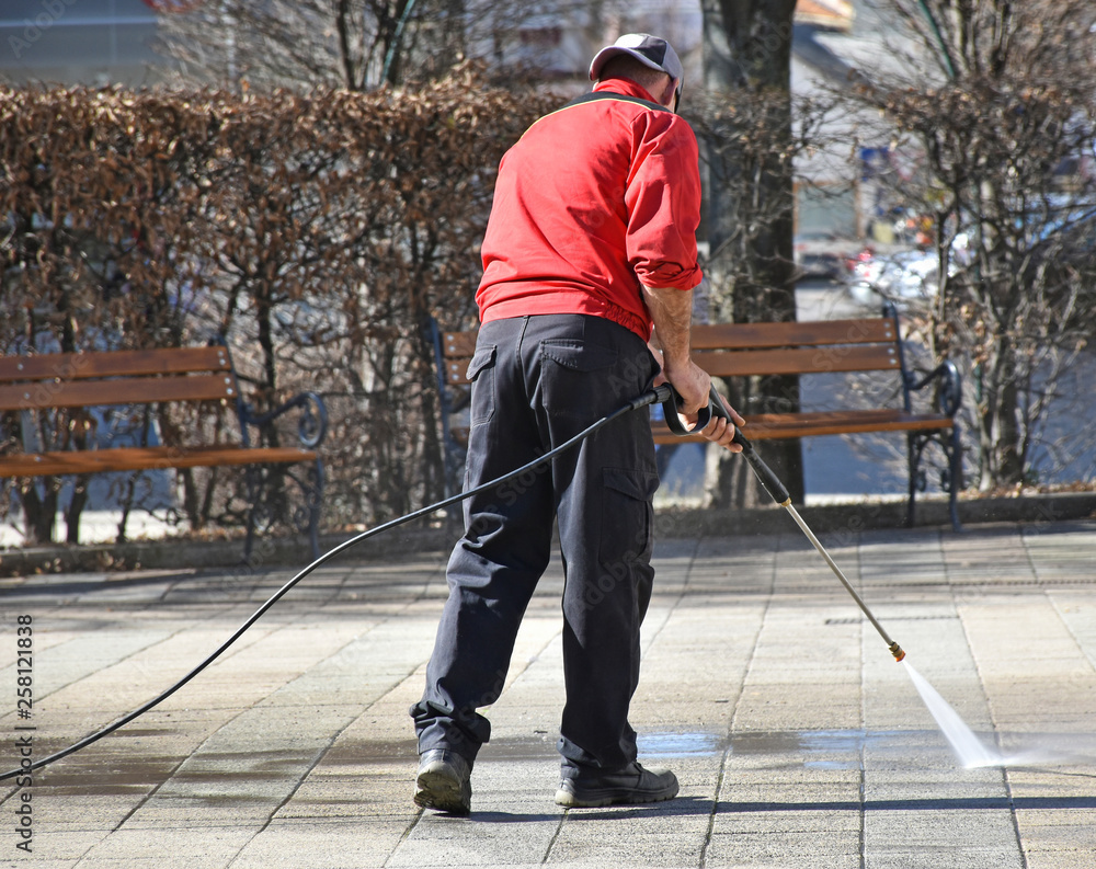 Street cleaner at work on the road