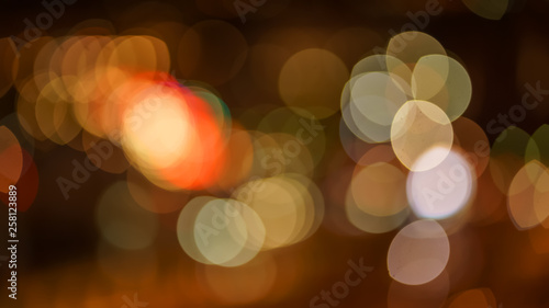 Abstract blurred blue, orange and yellow bokeh lights background © Sergey Bogomyako
