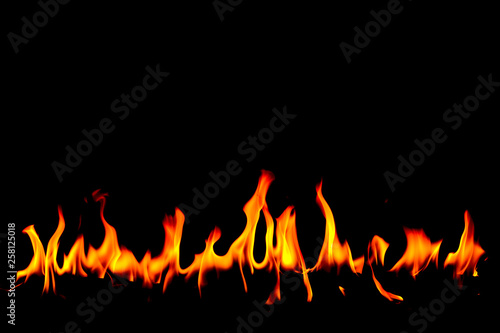 Fire flames on Abstract art black background, Burning red hot sparks rise, Fiery orange glowing flying particles