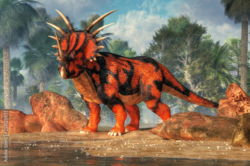 A red and black sytracosaurus stands on the sandy shores of a cretaceous era lake.  This spiky dinosaur is posing just for you. 3D Rendering photo