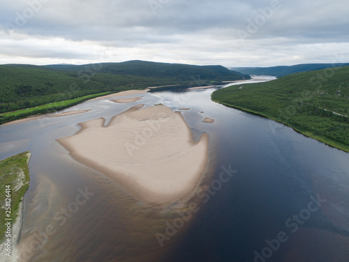 Aerial view of Teno aka Tana river between Norway and Finland at summer. Teno river is well known for its salmon fishery. photo
