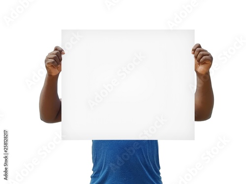 African man holding blank cardboard sign over his face on a white background - empty sign template