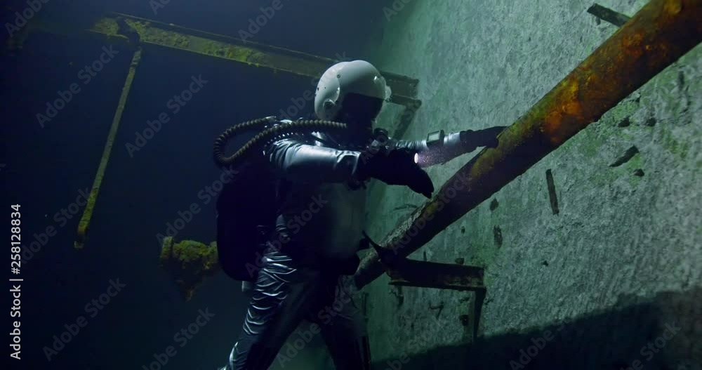 Diver exploring the Kobanya underwater mines, Budapest, Hungary Diver exploring the Kobanya underwater mines, Budapest, Hungary