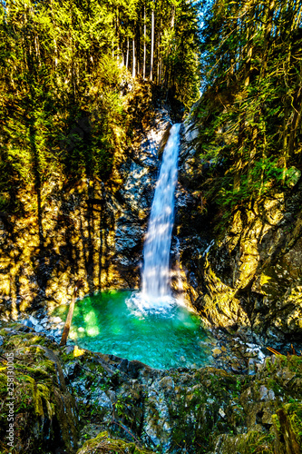 Fototapeta Naklejka Na Ścianę i Meble -  The turquoise waters of Cascade Falls in Cascade Falls Regional Park between the towns of Mission and Deroche in British Columbia, Canada
