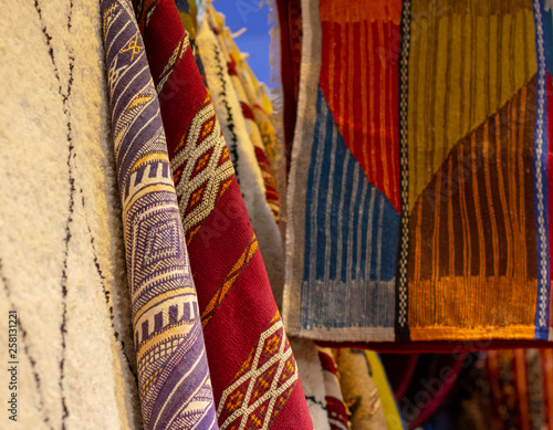 traditional handmade colorful carpets hanging for sale © Mariia
