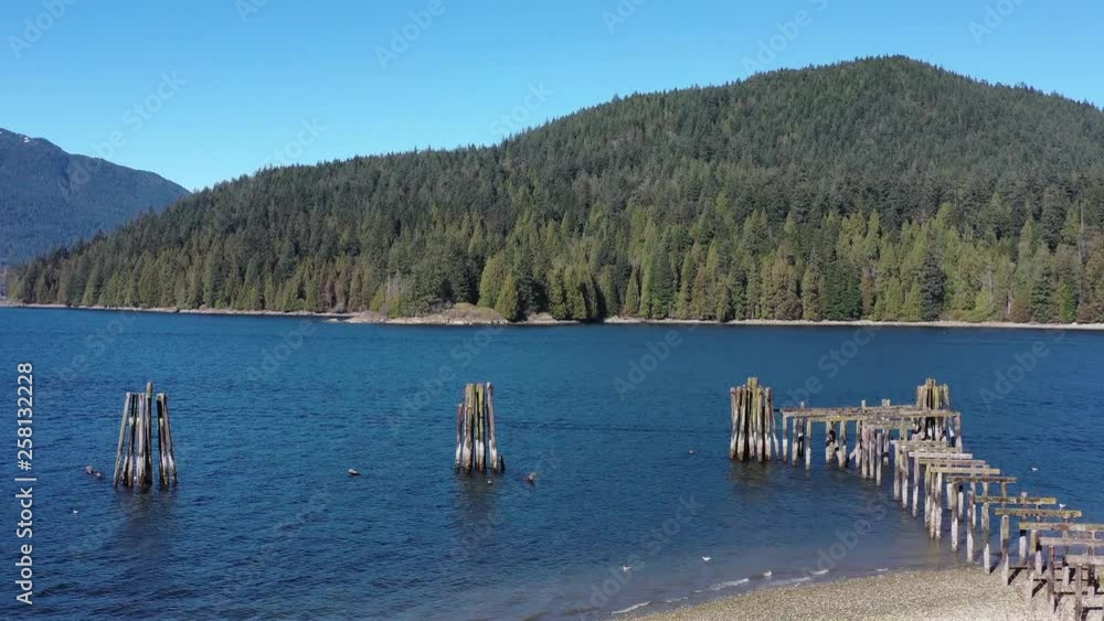 Aerial view over Burrard Inlet, ocean and island with mountains in beautiful British Columbia. Canada. 4K. Aerial view over Burrard Inlet, ocean and island with mountains in beautiful British Columbia. Canada. 4K.