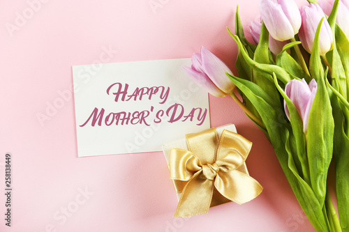 Multy purpose fresh flower composition, bouquet of purple tulips. International Women's day, mother's day greeting concept. Copy space, close up, top view, flat lay, background.