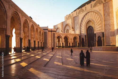 people walking in hassan ii mosquepeople walking in hassan II mosque square - Casablanca, Morocco