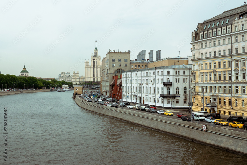 Obraz premium Stalin skyscraper on the background of the river. Moscow River view of the Stalinist skyscraper
