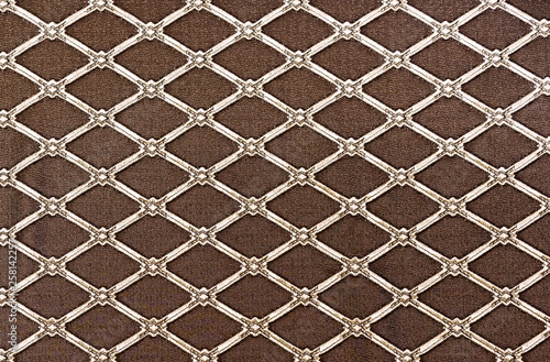 Diamond-shaped lattice on a brown background. Background for design and decoration.