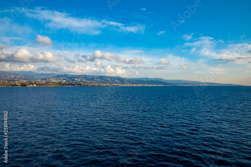 View of Strait of Messina connected Mediterranean and Tyrrhenian sea and Sicilia island background from ferry, Italy