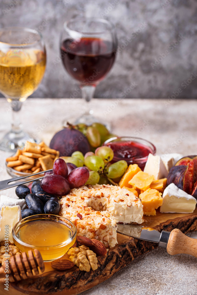 Cheese plate with grapes and wine Cheese plate with grapes and wine