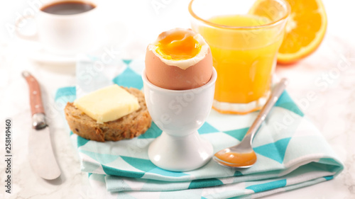 full breakfast with orange juice, egg and coffee cup