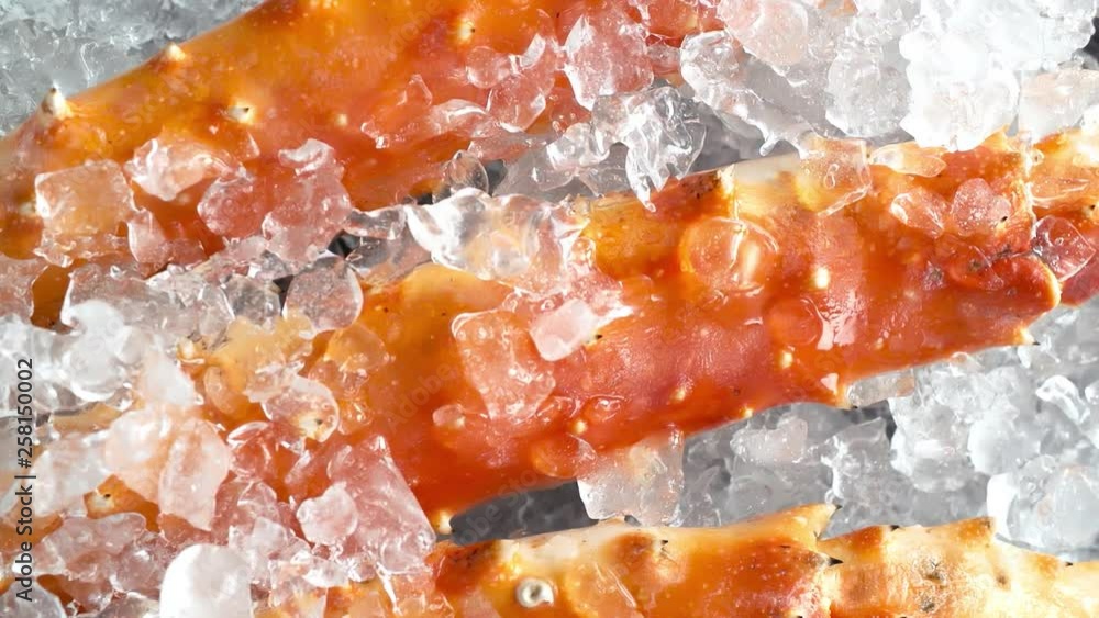 Close-up fresh crab with crushed ice in slow motion top view Close-up fresh crab with crushed ice in slow motion top view
