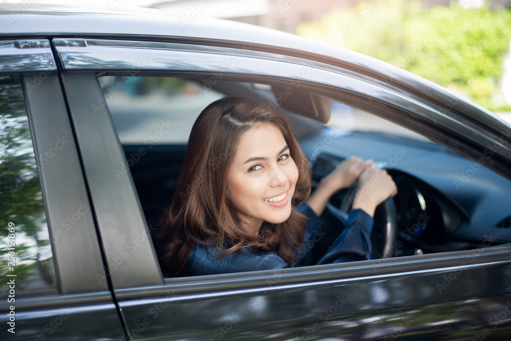 Beautiful woman is driving her car