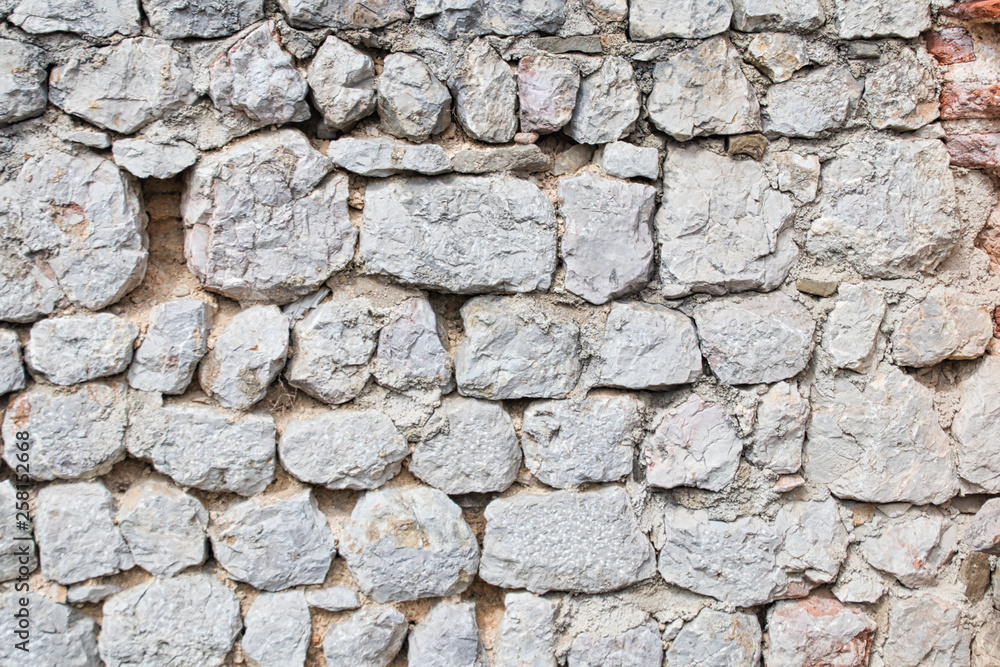 backround from an old stone wall in a ruin