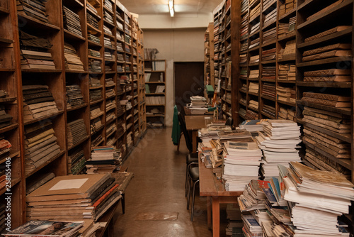 Vintage library room, storage, books on wooden shelves, antique, old paper, hall
