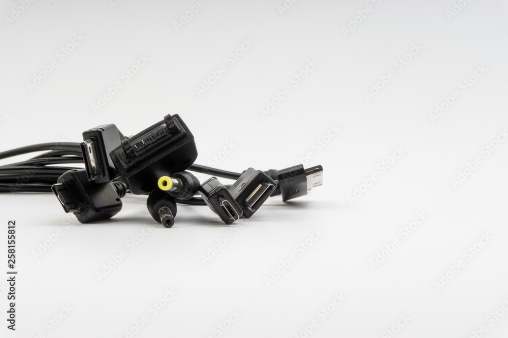 Universal recharger head isolated on white background. Selective focus and crop fragment Universal recharger head isolated on white background. Selective focus and crop fragment