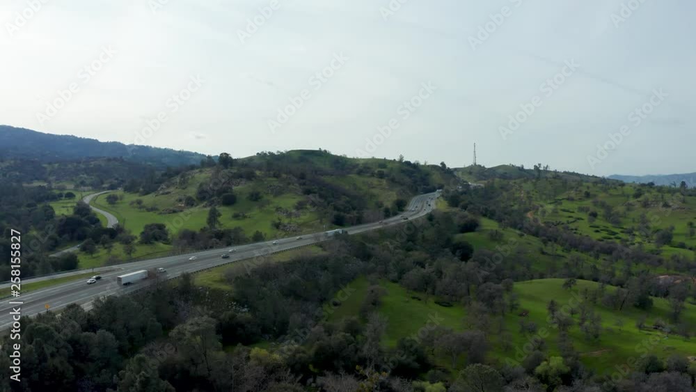 Aerial View of Highway in Green Foothill Mountains of Tehachapi, California Aerial View of Highway in Green Foothill Mountains of Tehachapi, California
