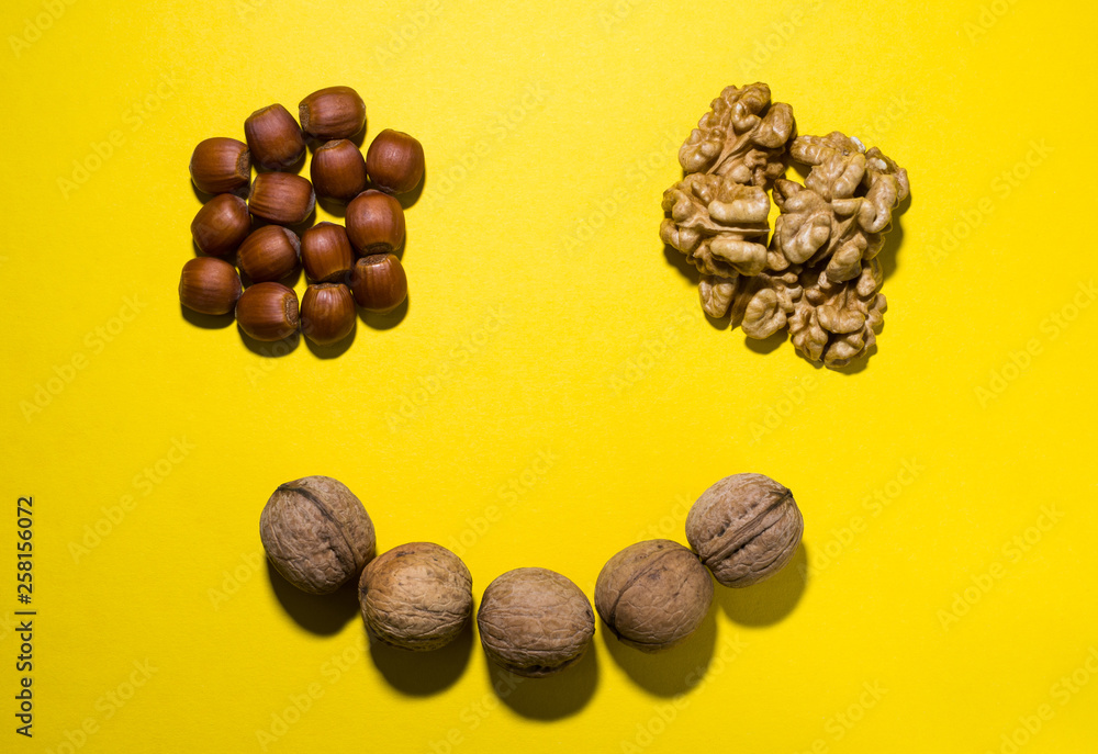 Obraz premium nuts on a yellow background