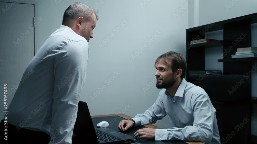 Two businessmen arguing and swearing in the office, the boss and the subordinate, slow motion Two businessmen arguing and swearing in the office, the boss and the subordinate, slow motion