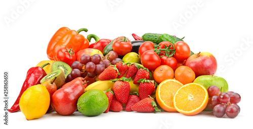 Heap different fruits, vegetables and berries isolated on white