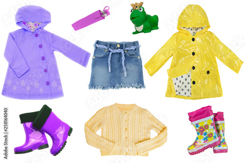 Collage set of little girl clothes isolated on a white background. The collection of  rain jackets, sweater, a jeans skirt, rubber boots and other equipment. Little girl fashion. © Olga