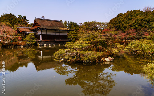Amazing landscape of Japanise garden over the lake in the Heian Shrine in Kyoto, Japan.