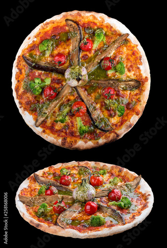 Vegetarian pizza with eggplant, broccoli and garlic. On dark background