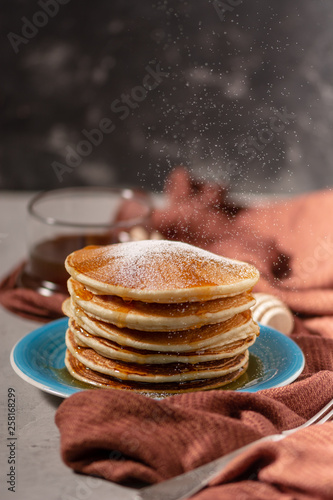 Wallpaper Mural Pancake folded stack of with liquid honey and sugar powder on stone background Torontodigital.ca