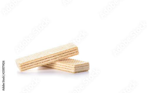 Multi-layered waffles with white creamy filling isolated on white background.