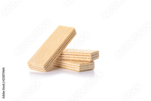 Multi-layered waffles with white creamy filling isolated on white background.
