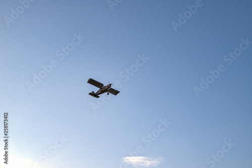 Small airplane against blue sky. Old small plane..