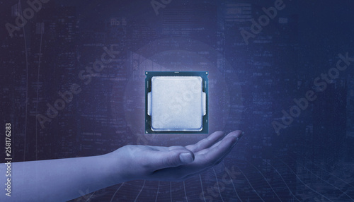 Hand holding processor. Concept of growth technology development and use in business.