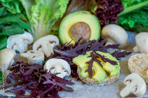  Keto, ketogenic diet, low carbohydrate, healthy diet. Healthy food: spinach, avocado, cereals, champignons, Mizuno on a black rustic background, concept of diet photo