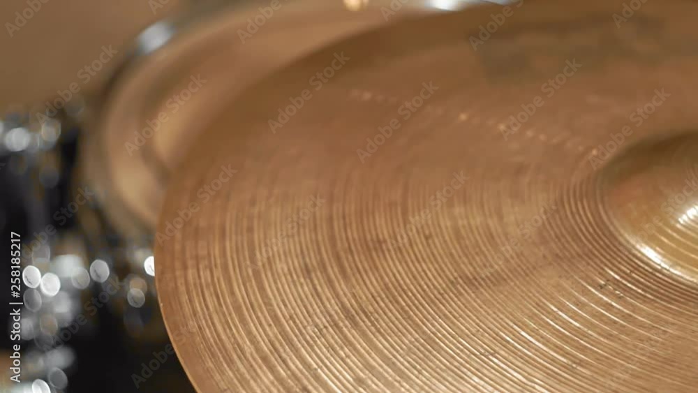 playing a musical instrument cymbal drumstick close up playing a musical instrument cymbal drumstick close up