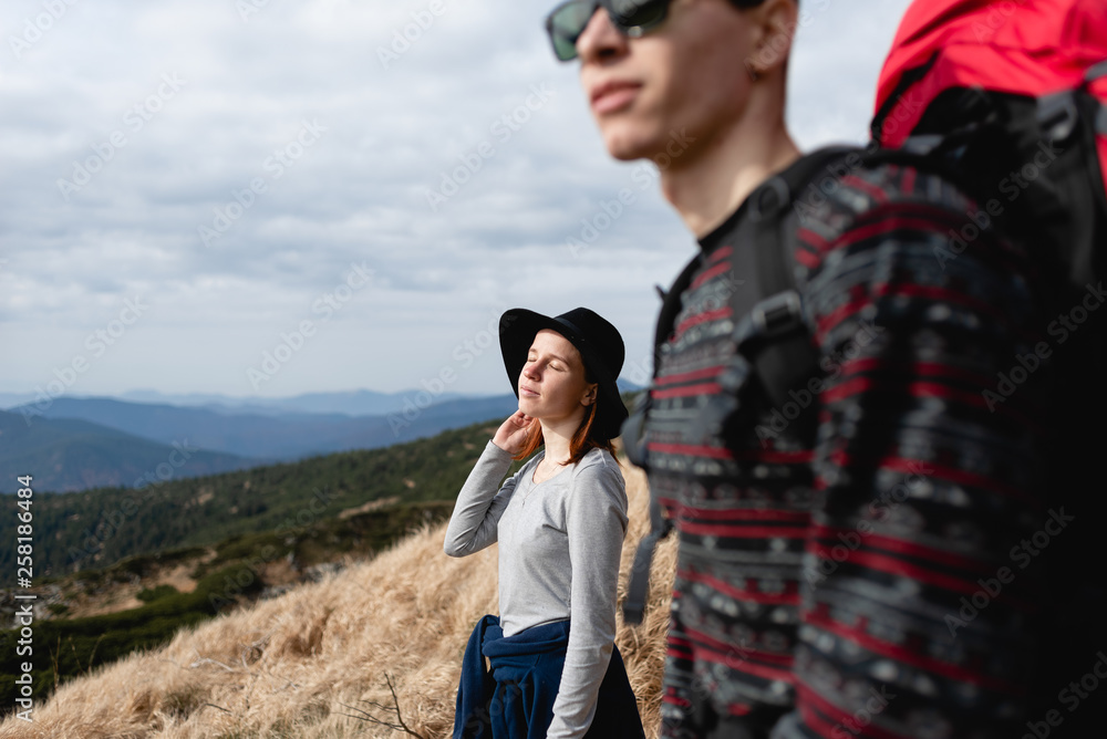 Traveling couple in love to the top of the mountain. Traveling couple in love to the top of the mountain.