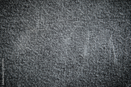 Textures of black jeans denim fabrics for the background. © Andrii A