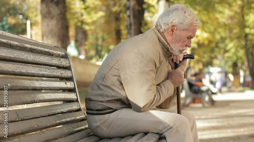 Unhappy troubled unsatisfied old man. Tired of life gray-haired man suffering