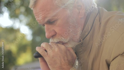 Wallpaper Mural Thoughtful older adult in bad mood sitting in park. Fall age depression disease Torontodigital.ca