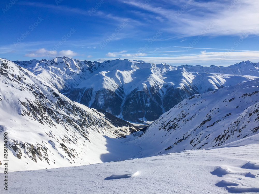 Obraz premium Swiss mountains on a cold winter day. Snow covered peaks in remote area.