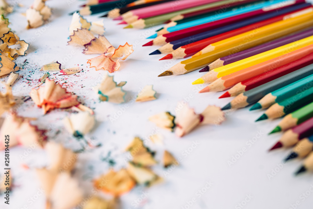 Sharpened crayons and colored shavings on paper Sharpened crayons and colored shavings on paper