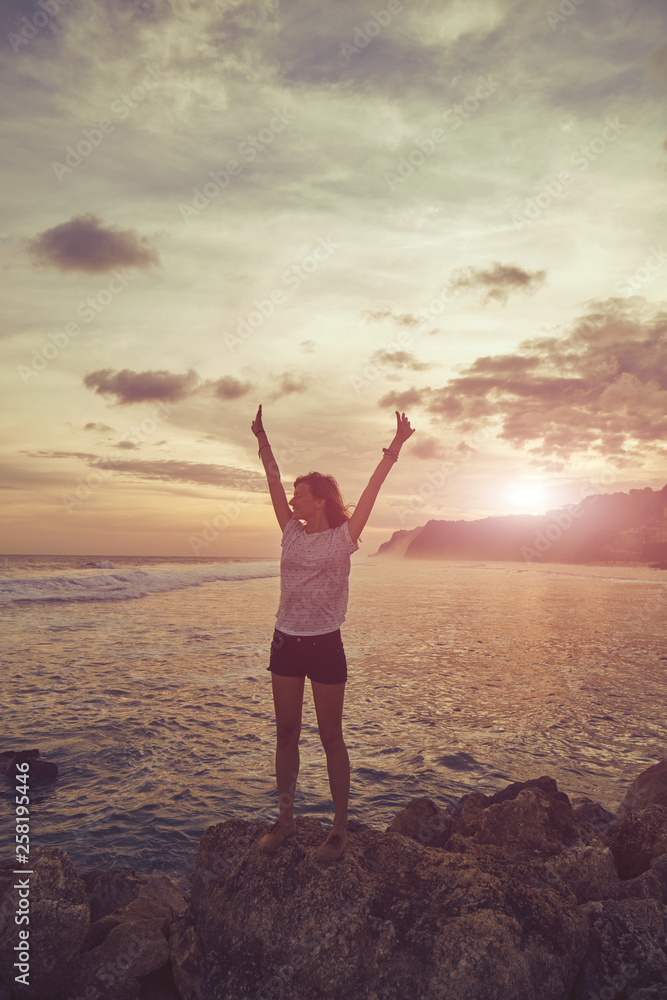 Fototapeta premium Attractive woman enjoying on the beach.