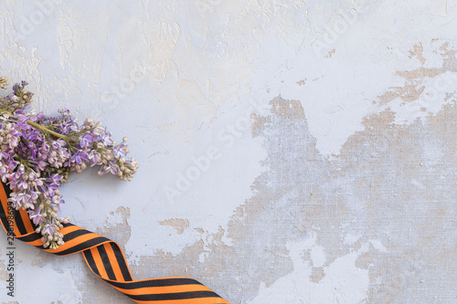 St. George ribbon and lilac, may 9 Victory Day concept, symbol of the Second World war. photo