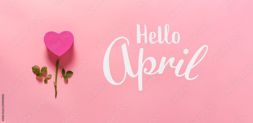 Hello April message with heart flower top view flat lay