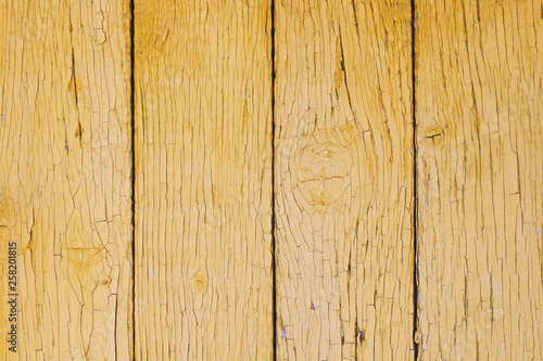 Old yellow wooden boards. Close-up. Vertical view. Background. Texture.