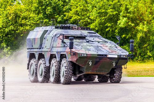 German armoured carrier, from german army, drives on a road