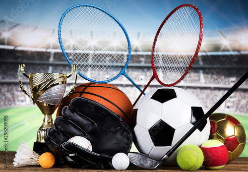 Sport equipment and balls, stadium background