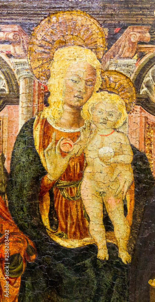 Fototapeta premium Pavia, Italy. 2017/11/11.. The painting of the Virgin Mary with the Infant Jesus on a throne between St. Catherine of Alexandria and St. Anthony the Abbot (the Great). Currently in Castello Visconteo.