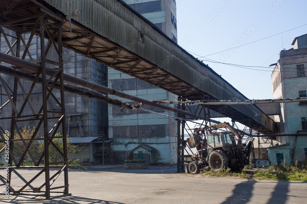 Buildings for storage and transportation. The metal structures of the tower and towers in the obsolete plant of eastern europe, the impact on environmental pollution